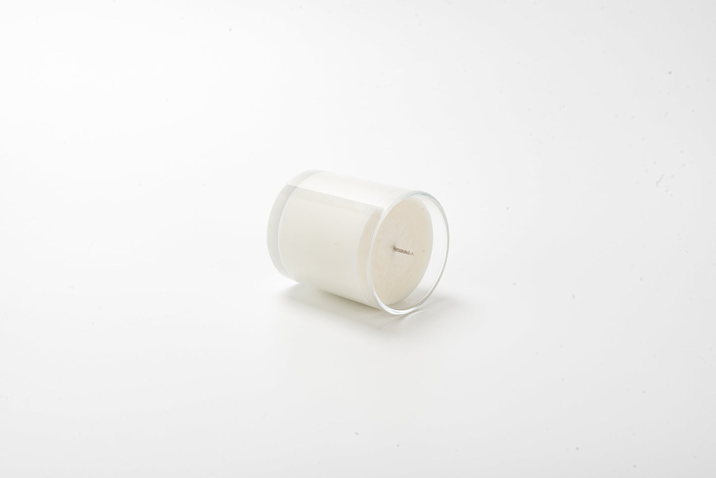 White candle on a white background