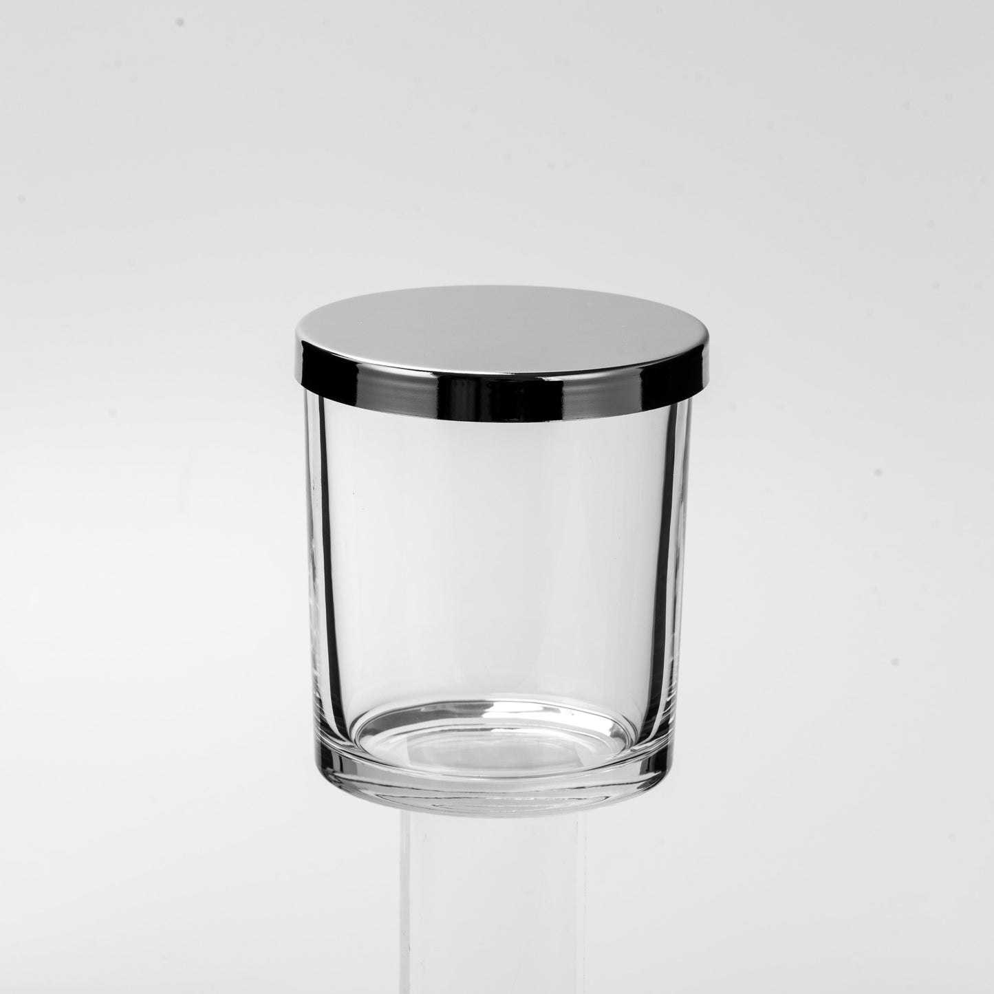 Clear glass with silver rim on a white background