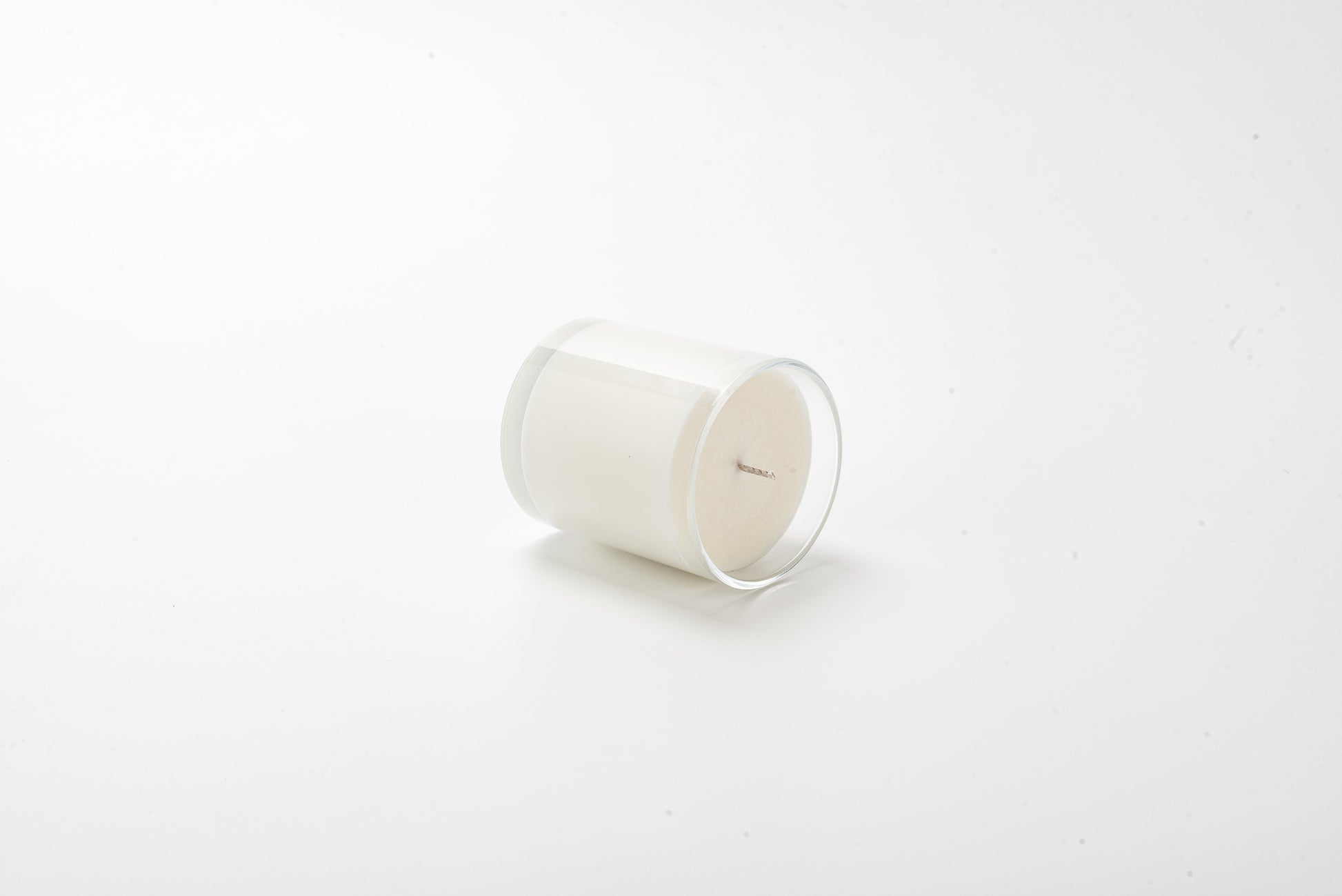 White candle on a white background