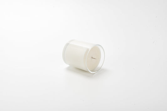 White candle on a white background