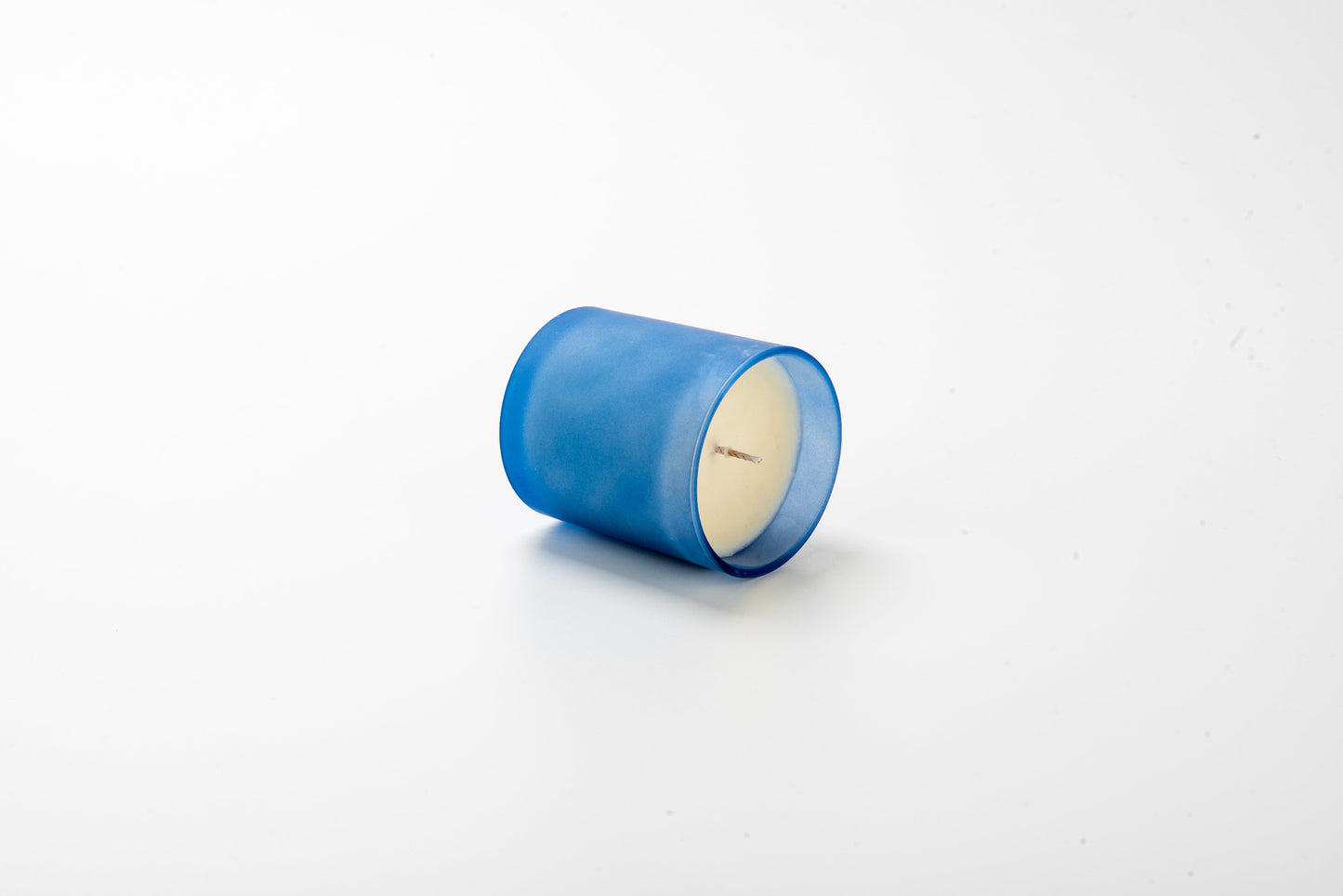 Blue candle on a white background