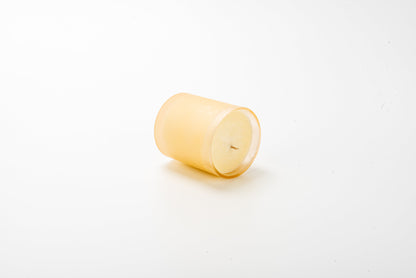 Yellow candle on a white background