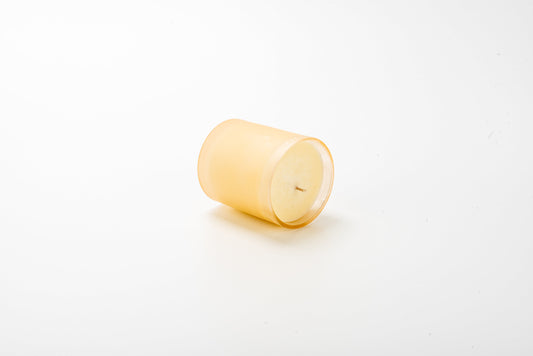 Yellow candle on a white background