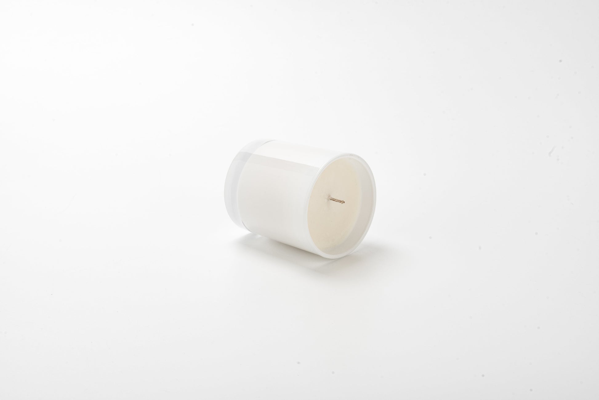 White candle on a white background