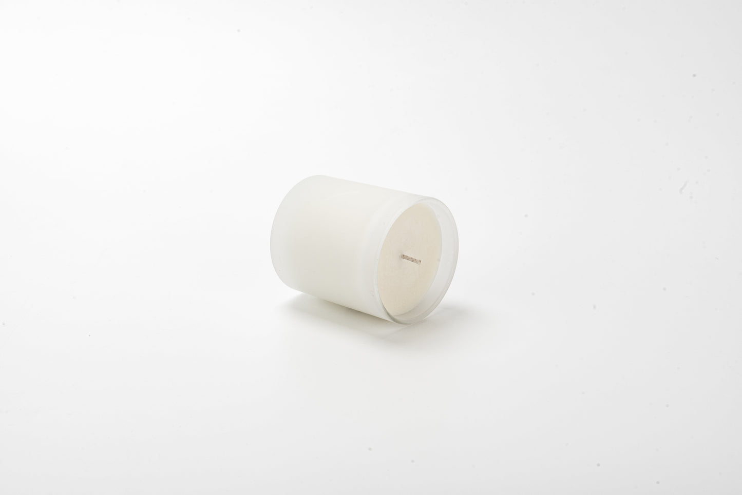 White candle on a white background