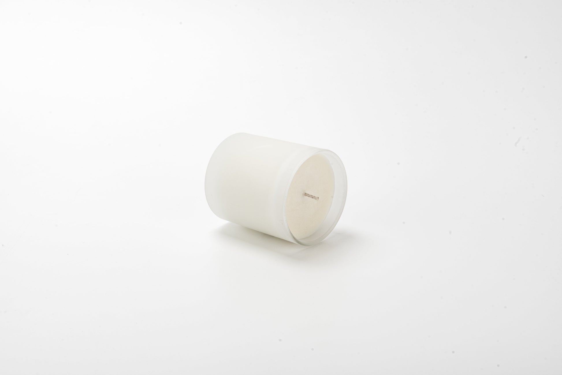 White candle on a white background