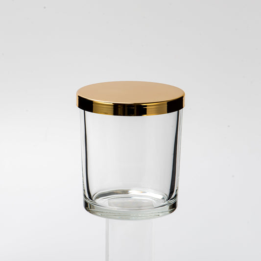 Clear glass stool with gold accents on a white background