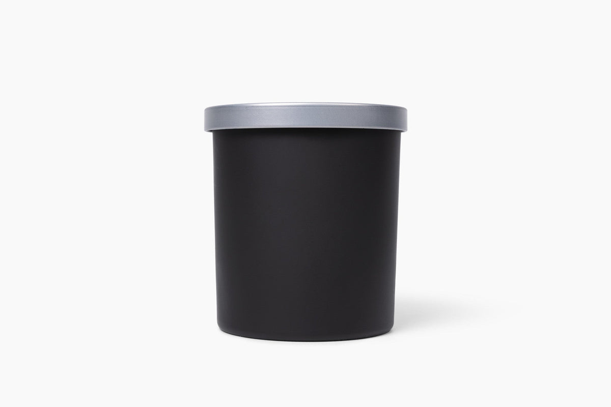 Aroma Crafters 8oz Classic custom candle in a matte black vessel with brushed silver lid, white background