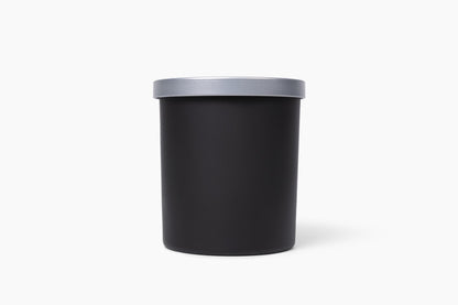 Aroma Crafters 8oz Classic custom candle in a matte black vessel with brushed silver lid, white background